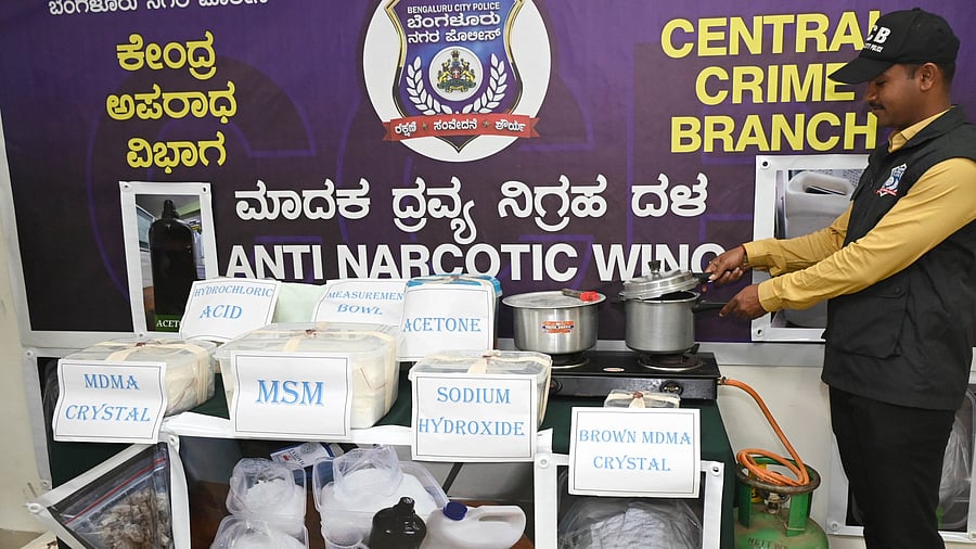 <div class="paragraphs"><p>A CCB sleuth inspects the narcotics seized in Bengaluru. Representative image.</p></div>